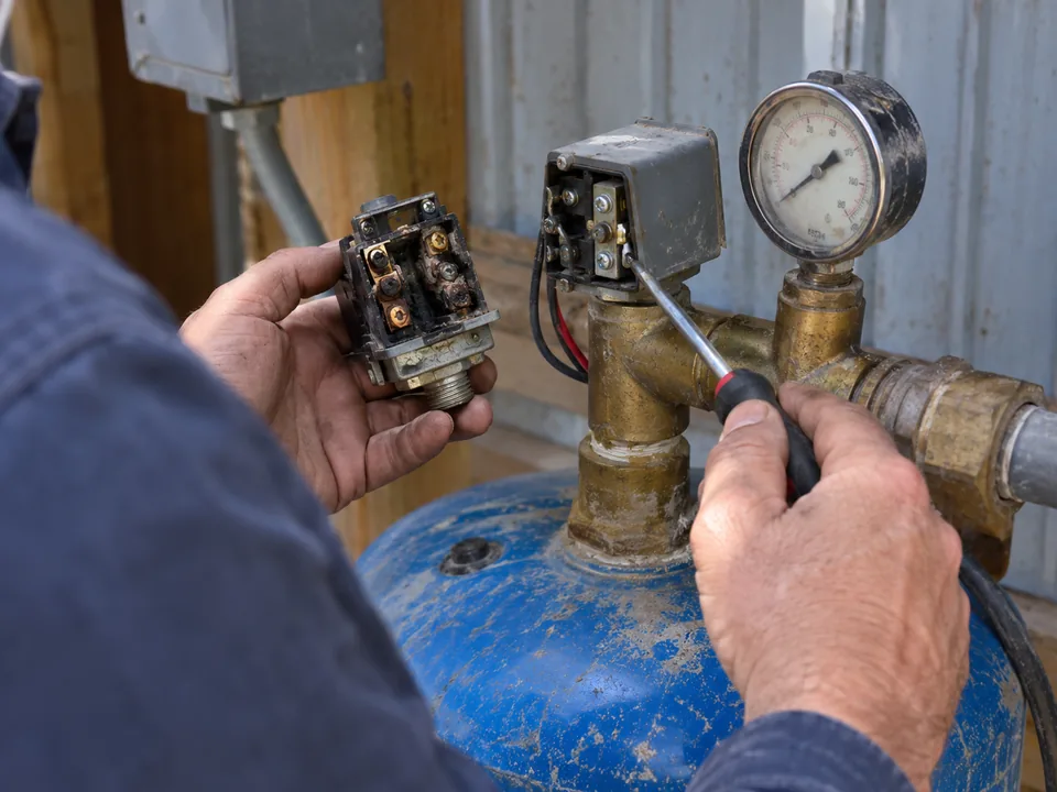 Replacing a well pressure switch with burned, pitted contacts on the tank tee